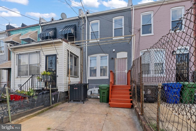 back of property featuring central air condition unit