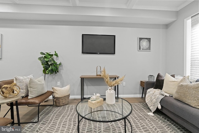 living room with crown molding, beam ceiling, and hardwood / wood-style floors