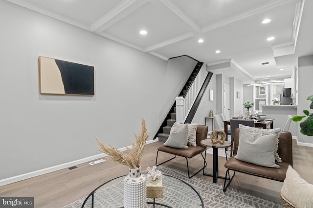 interior space featuring wood-type flooring, beamed ceiling, and crown molding