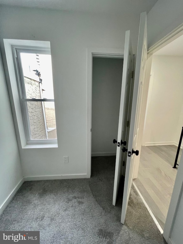 unfurnished bedroom featuring hardwood / wood-style flooring