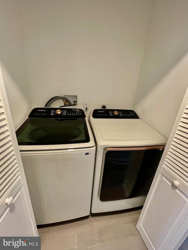 laundry area with washer and clothes dryer