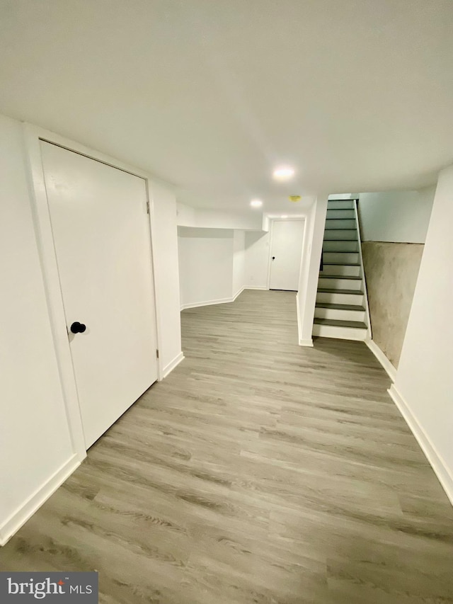 basement featuring light wood-type flooring