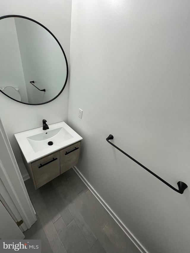 bathroom featuring wood-type flooring and vanity