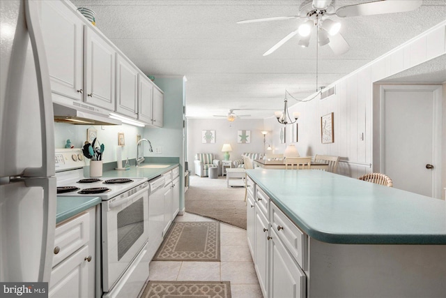 kitchen with ceiling fan, white cabinets, and white appliances