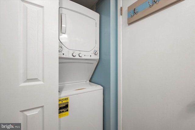 washroom with stacked washer and dryer