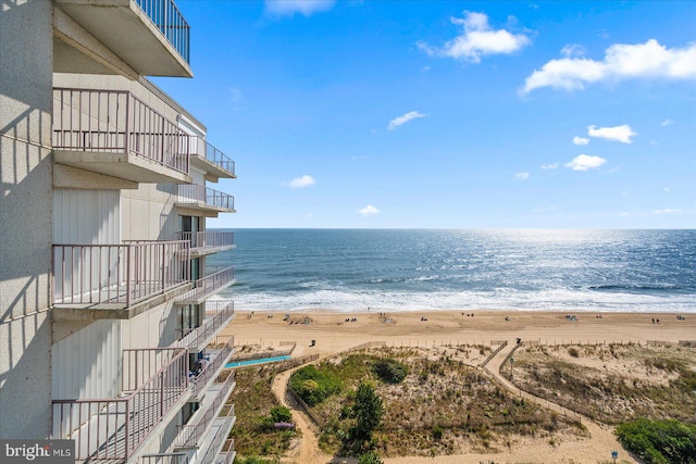 property view of water featuring a beach view