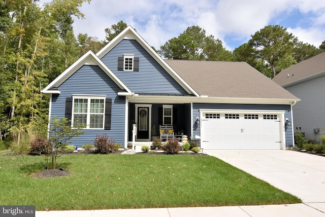 view of front of home featuring a garage and a front lawn