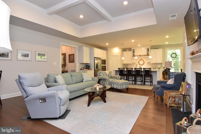 living room featuring beamed ceiling, dark hardwood / wood-style floors, and crown molding