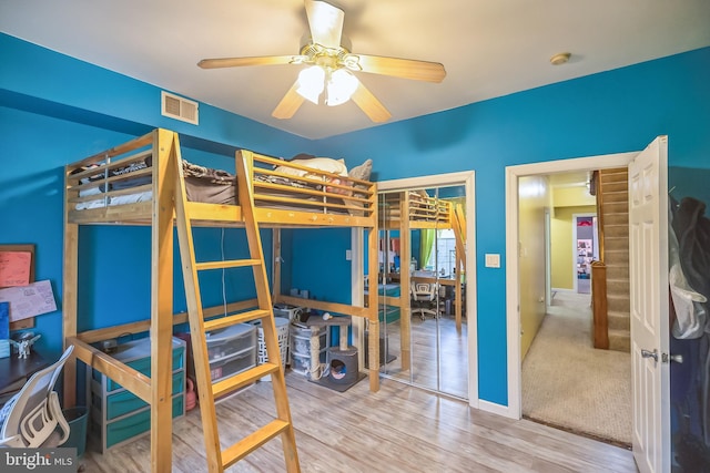 bedroom featuring a closet, ceiling fan, and hardwood / wood-style floors