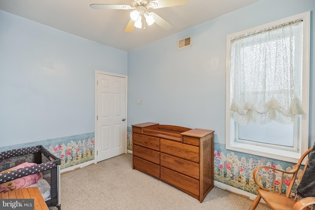 carpeted bedroom featuring ceiling fan