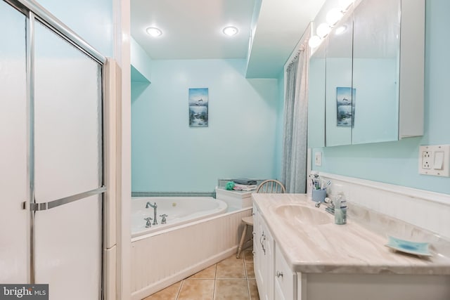 bathroom featuring vanity, shower with separate bathtub, and tile patterned floors