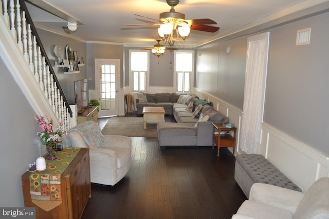 living room with ornamental molding, ceiling fan, and dark hardwood / wood-style floors