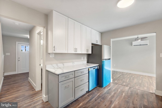 kitchen with white cabinets, ceiling fan, appliances with stainless steel finishes, and dark wood-type flooring