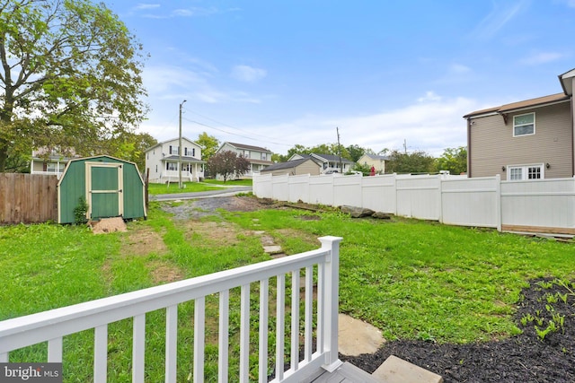 view of yard with a storage unit