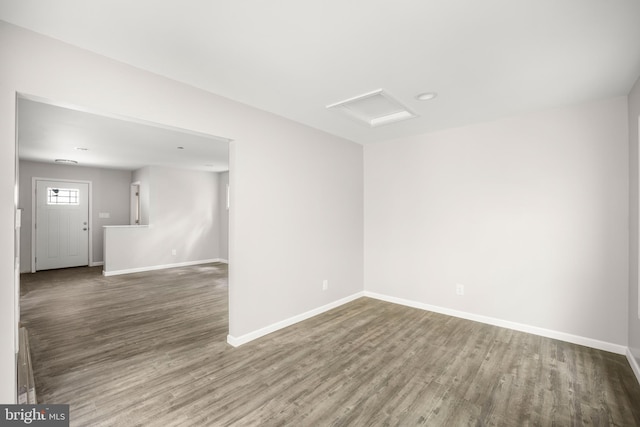 unfurnished room with hardwood / wood-style flooring