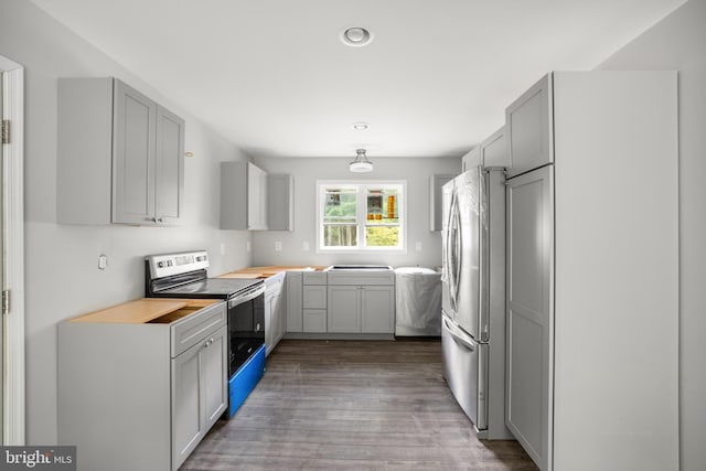 kitchen featuring gray cabinetry, light hardwood / wood-style floors, and stainless steel appliances