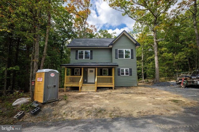 view of property featuring covered porch