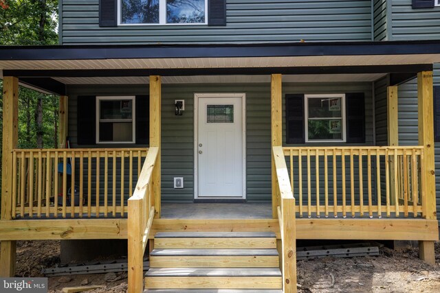 entrance to property with covered porch