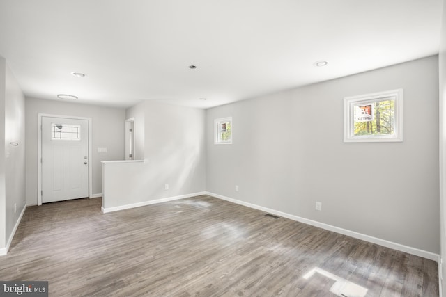 unfurnished room featuring hardwood / wood-style floors