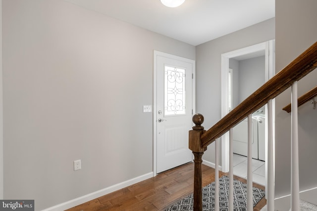 foyer entrance featuring wood-type flooring