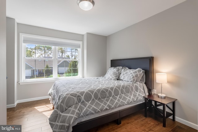 bedroom with hardwood / wood-style flooring