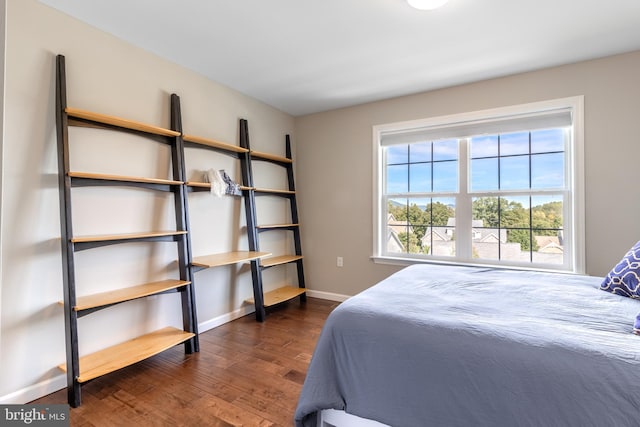 bedroom featuring dark wood-type flooring