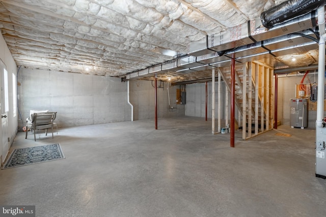 basement featuring electric water heater