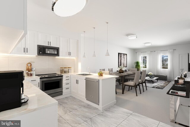 4910 E Capitol NE, Washington, DC 20019 - kitchen featuring a sink, a peninsula, open floor plan, stainless steel appliances, and white cabinets