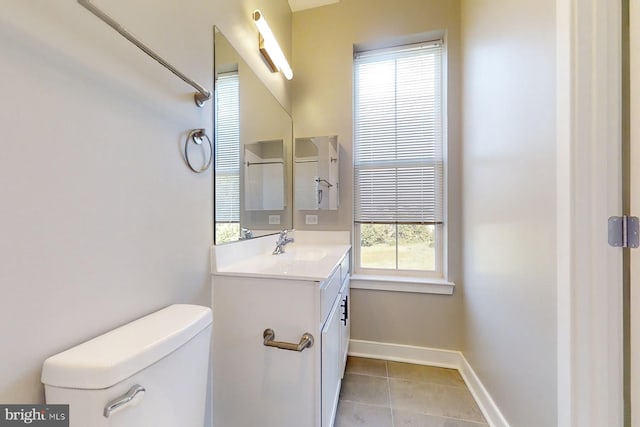 4910 E Capitol NE, Washington, DC 20019 - bathroom featuring toilet, vanity, tile patterned floors, and baseboards