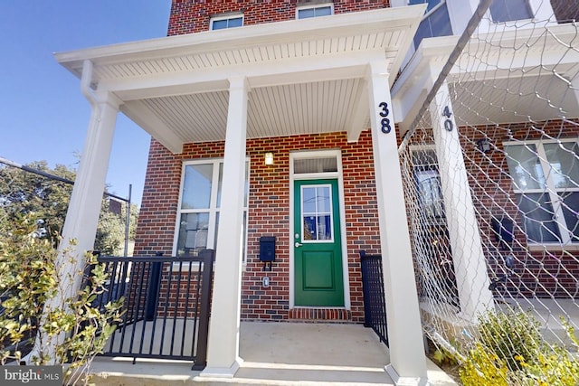 property entrance with covered porch