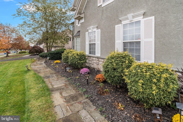 view of home's exterior featuring a lawn