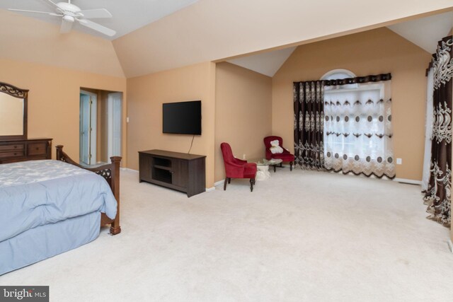 bedroom with lofted ceiling, ceiling fan, and light colored carpet