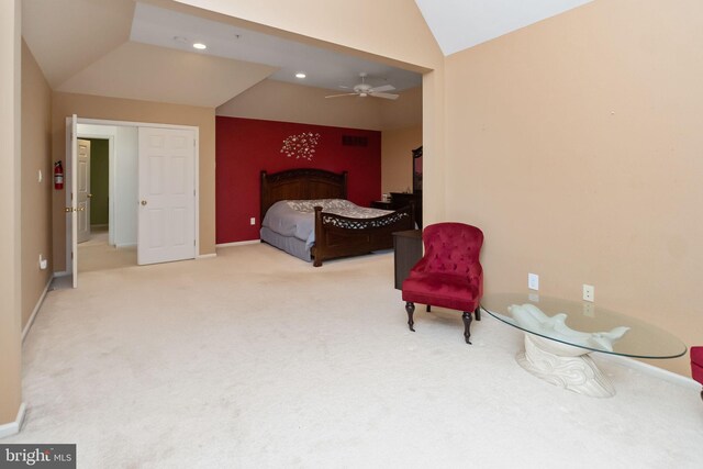 bedroom featuring light carpet, vaulted ceiling, and ceiling fan