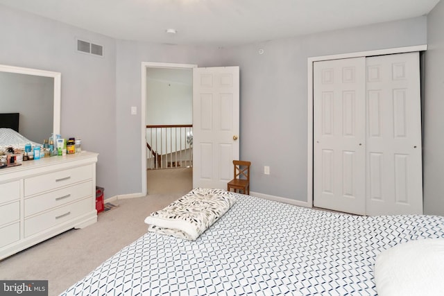 carpeted bedroom featuring a closet