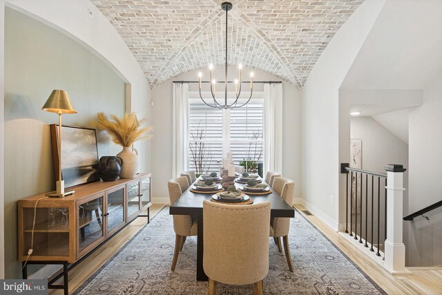 300 Friar Rock Cir, Havre De Grace, MD 21078 - dining room featuring an inviting chandelier, brick ceiling, wood finished floors, baseboards, and vaulted ceiling