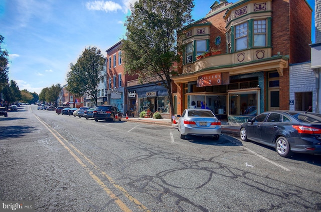 view of building exterior with uncovered parking