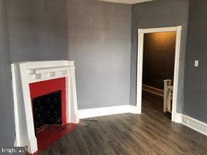 living room featuring dark hardwood / wood-style flooring