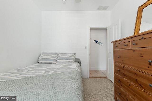 bedroom featuring light colored carpet