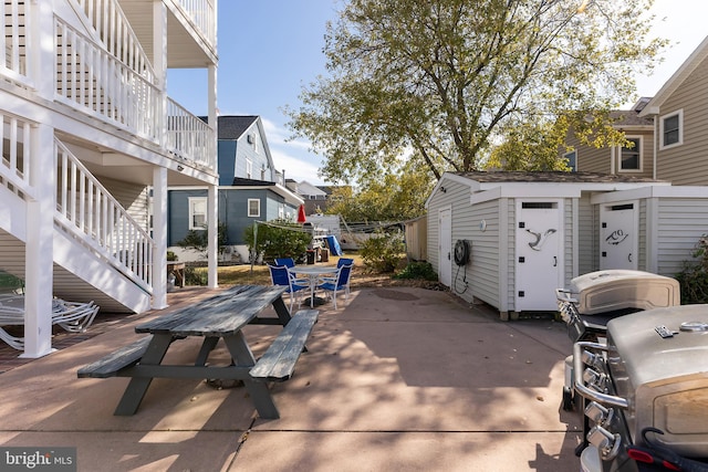 view of patio with a storage shed