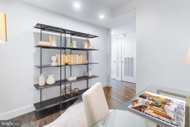 office space with dark hardwood / wood-style flooring