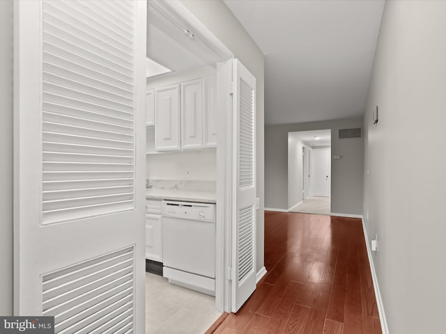 hall with light hardwood / wood-style floors