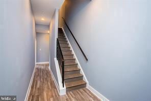 staircase featuring hardwood / wood-style flooring