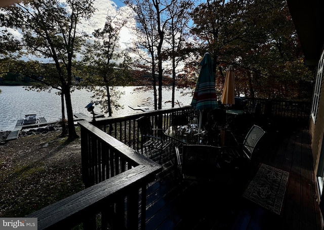 wooden deck with a water view