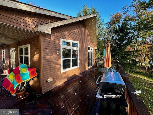 view of side of property featuring a deck