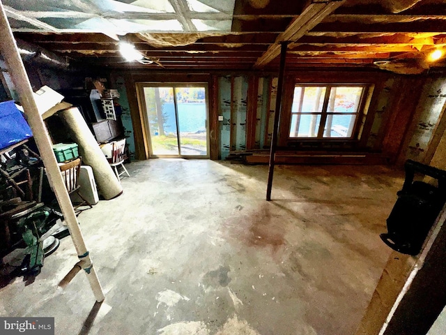 miscellaneous room featuring concrete flooring and a healthy amount of sunlight