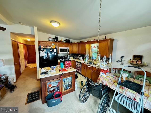 kitchen with light carpet, black appliances, decorative light fixtures, and decorative backsplash