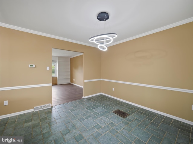 spare room with a notable chandelier, dark wood-type flooring, and ornamental molding