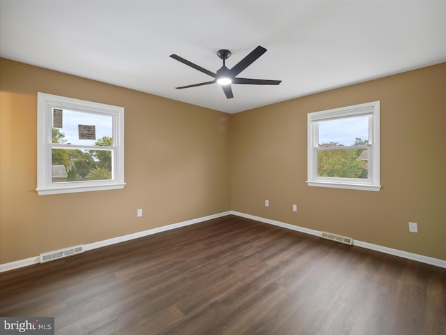 unfurnished room featuring ceiling fan and dark hardwood / wood-style floors