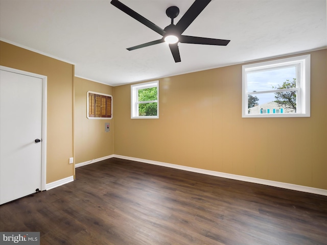 empty room featuring ceiling fan and dark hardwood / wood-style floors