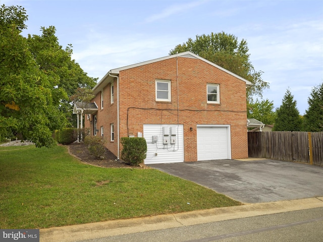 view of property exterior with a yard and a garage